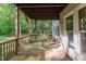 View of a covered outdoor deck providing a relaxing space for outdoor enjoyment at 208 W Camden Forest Dr, Cary, NC 27518
