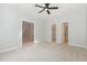 A peaceful bedroom with carpeting and ceiling fan, offering a serene retreat with plenty of closet space at 208 W Camden Forest Dr, Cary, NC 27518
