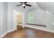 Bonus room with window seat, carpeted platform, and access to a walk-in closet at 208 W Camden Forest Dr, Cary, NC 27518