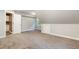 Bonus room with vaulted ceiling, neutral walls, carpet flooring and a glimpse of the ensuite bathroom at 208 W Camden Forest Dr, Cary, NC 27518