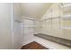 Walk-in closet with wood floor, wire shelving and a window at 208 W Camden Forest Dr, Cary, NC 27518