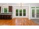 The dining room features hardwood floors, natural light, and transitions into the kitchen area at 208 W Camden Forest Dr, Cary, NC 27518