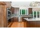 Gourmet kitchen with stainless steel appliances and a central island, offering a chef's dream at 208 W Camden Forest Dr, Cary, NC 27518