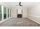 Living room with carpet, fireplace and view to outside at 208 W Camden Forest Dr, Cary, NC 27518