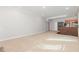 A spacious carpeted living room with neutral walls and access to other areas of the home at 208 W Camden Forest Dr, Cary, NC 27518