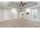Spacious main bedroom with neutral walls, carpet flooring, ceiling fan and ensuite bathroom at 208 W Camden Forest Dr, Cary, NC 27518