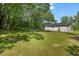 Spacious backyard surrounded by mature trees, providing privacy and ample space at 2108 Laurel Mill Centerville Rd, Louisburg, NC 27549