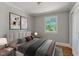 Cozy bedroom with neutral tones, plush bedding, and bright window views to the outside at 2108 Laurel Mill Centerville Rd, Louisburg, NC 27549