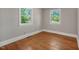 Bright room featuring hardwood floors and two windows providing plenty of natural light at 2108 Laurel Mill Centerville Rd, Louisburg, NC 27549