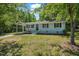 Charming single-story home featuring a covered front porch and well-maintained landscaping at 2108 Laurel Mill Centerville Rd, Louisburg, NC 27549