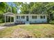 Charming single-story home featuring a covered front porch and well-maintained landscaping at 2108 Laurel Mill Centerville Rd, Louisburg, NC 27549