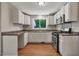 Bright kitchen with white cabinets, stainless steel appliances, and natural light at 2108 Laurel Mill Centerville Rd, Louisburg, NC 27549