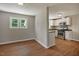 Open floor plan view of the kitchen and dinning area with wooden floors at 2108 Laurel Mill Centerville Rd, Louisburg, NC 27549
