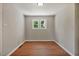 Room featuring wood look floor and large window offering outside view at 2108 Laurel Mill Centerville Rd, Louisburg, NC 27549