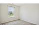 Bright bedroom featuring neutral walls, carpet, and a window that lets in natural light at 2207 Bankshill Row, Raleigh, NC 27614