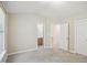Spacious bedroom with neutral walls and carpet, with an ensuite bathroom and walk-in closet at 2207 Bankshill Row, Raleigh, NC 27614