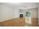 Spacious living room with fireplace, ceiling fan, and sliding doors to the outside at 2207 Bankshill Row, Raleigh, NC 27614