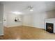 Open-concept living room featuring a fireplace and view of the kitchen at 2207 Bankshill Row, Raleigh, NC 27614