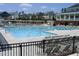Community pool with lounge chairs and a slide at 2207 Bankshill Row, Raleigh, NC 27614