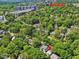 An aerial photo of a property in a tree-filled neighborhood near NC State University at 224 E Park Dr, Raleigh, NC 27605