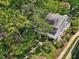 Lush aerial view of a charming home nestled among mature trees and landscaping at 224 E Park Dr, Raleigh, NC 27605