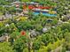 Aerial view of home near St. Mary's School with lush, mature trees, creating a serene environment at 224 E Park Dr, Raleigh, NC 27605