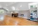 Large attic space featuring hardwood floors, built-in shelves, and plenty of natural light at 224 E Park Dr, Raleigh, NC 27605