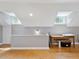 Attic space with hardwood floors, skylights, and a desk area, great for storage or a study at 224 E Park Dr, Raleigh, NC 27605