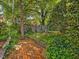 Beautiful brick pathway winding through a lush, green backyard space at 224 E Park Dr, Raleigh, NC 27605