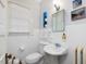 Bathroom features classic fixtures, white tile, and natural light from a window at 224 E Park Dr, Raleigh, NC 27605