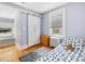 Bright bedroom with a barn door closet and blue patterned bedding at 224 E Park Dr, Raleigh, NC 27605