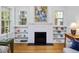 White fireplace with hearth and built-in shelves, with decor items at 224 E Park Dr, Raleigh, NC 27605