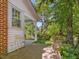 Inviting front porch with classic columns and tranquil surroundings at 224 E Park Dr, Raleigh, NC 27605
