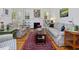 Comfortable living room featuring a fireplace, built-in shelves, and plaid furniture at 224 E Park Dr, Raleigh, NC 27605
