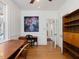 Office area features desk, hardwood floors, and plenty of natural light at 224 E Park Dr, Raleigh, NC 27605