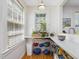 Bright pantry features built-in shelving, counter space, natural light and view to exterior at 224 E Park Dr, Raleigh, NC 27605