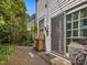 Private brick patio with sliding door and convenient potting table at 224 E Park Dr, Raleigh, NC 27605