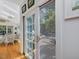 Bright sunroom with hardwood floors, ceiling fans, and access to the outdoors at 224 E Park Dr, Raleigh, NC 27605