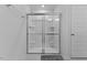 Modern bathroom featuring a frameless glass shower with built-in shelves and a sleek design at 230 Purple Aster St St, Youngsville, NC 27596