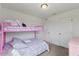 bedroom featuring a pink bunk bed with two doors for storage and easy access to personal items at 230 Purple Aster St St, Youngsville, NC 27596