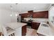 Well-lit kitchen featuring granite counters, stainless appliances, and center island that opens up to the dining area at 230 Purple Aster St St, Youngsville, NC 27596