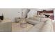 Open-concept living area with a sectional sofa, modern furniture, and a view of the dining area and kitchen, enhancing the flow at 230 Purple Aster St St, Youngsville, NC 27596