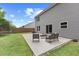 Relaxing patio area with outdoor seating and gray concrete pad, ideal for entertaining in a private backyard setting at 230 Purple Aster St St, Youngsville, NC 27596