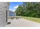 Backyard patio with outdoor seating, perfect for relaxing and enjoying the private, tree-lined backyard at 230 Purple Aster St St, Youngsville, NC 27596