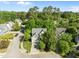 Aerial view of home showing manicured lawn and beautiful trees surrounding the property at 2309 Clerestory Pl, Raleigh, NC 27615