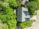 Aerial view showcases roof and trees, emphasizing the privacy of the home at 2309 Clerestory Pl, Raleigh, NC 27615