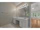 Bathroom boasts dual sinks, large mirror, and natural light from nearby windows at 2309 Clerestory Pl, Raleigh, NC 27615