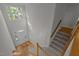 Grand entryway with hardwood floors, carpeted stairs, a large window, and natural light at 2309 Clerestory Pl, Raleigh, NC 27615