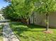 Exterior view of home with well maintained lawn, trees, and manicured landscaping at 2309 Clerestory Pl, Raleigh, NC 27615