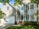 Attractive exterior of a home with brick stairs, white trim, and a well-maintained front yard at 2309 Clerestory Pl, Raleigh, NC 27615
